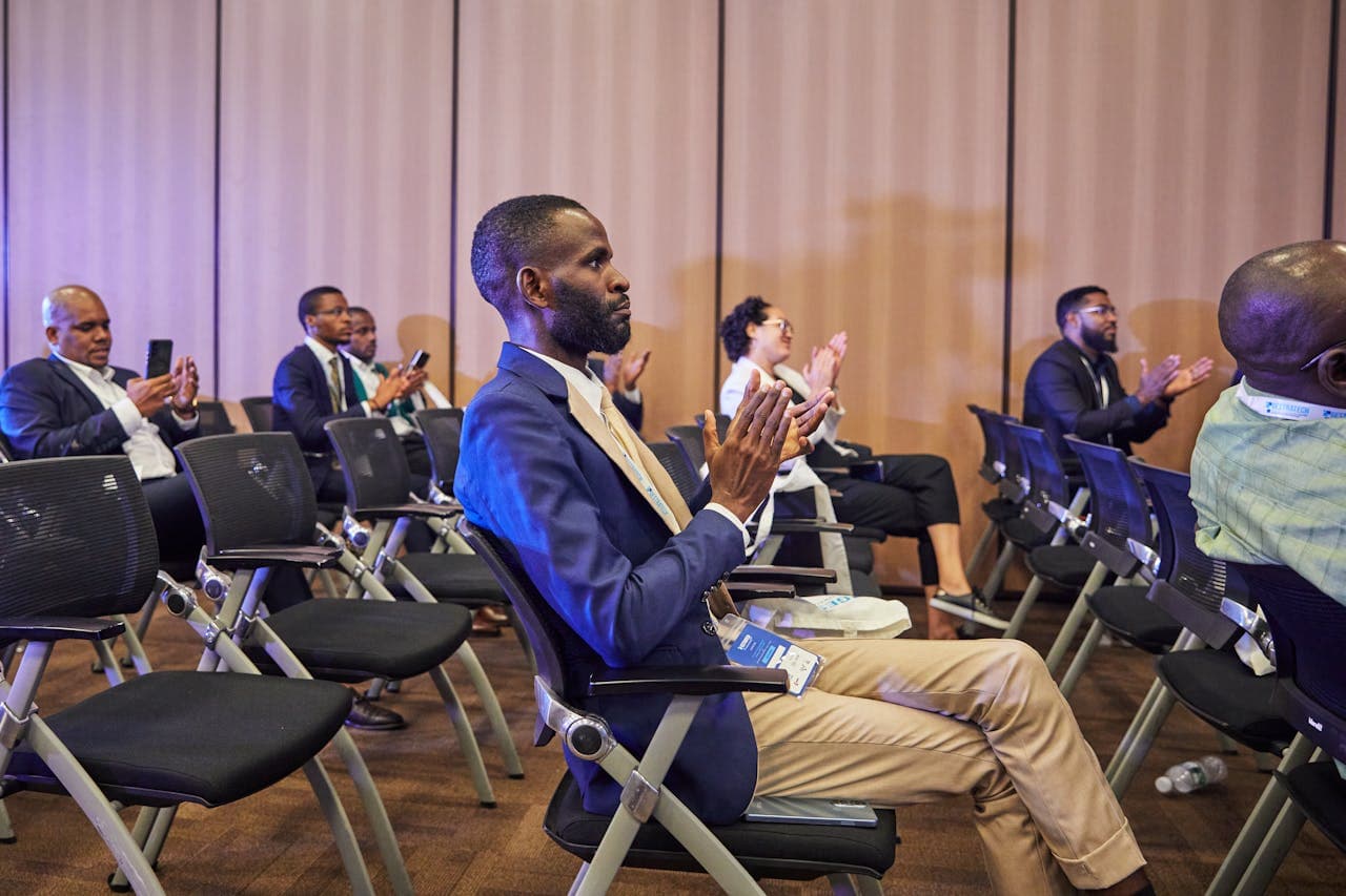 Professionals applauding at a chapter meeting